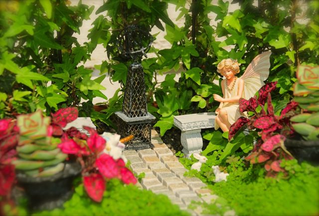fairy-sitting-in-garden